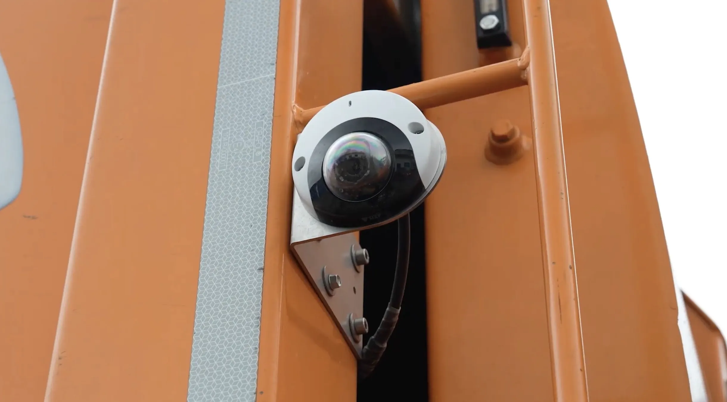 A CAMAN camera mounted on the body of a waste collection truck
